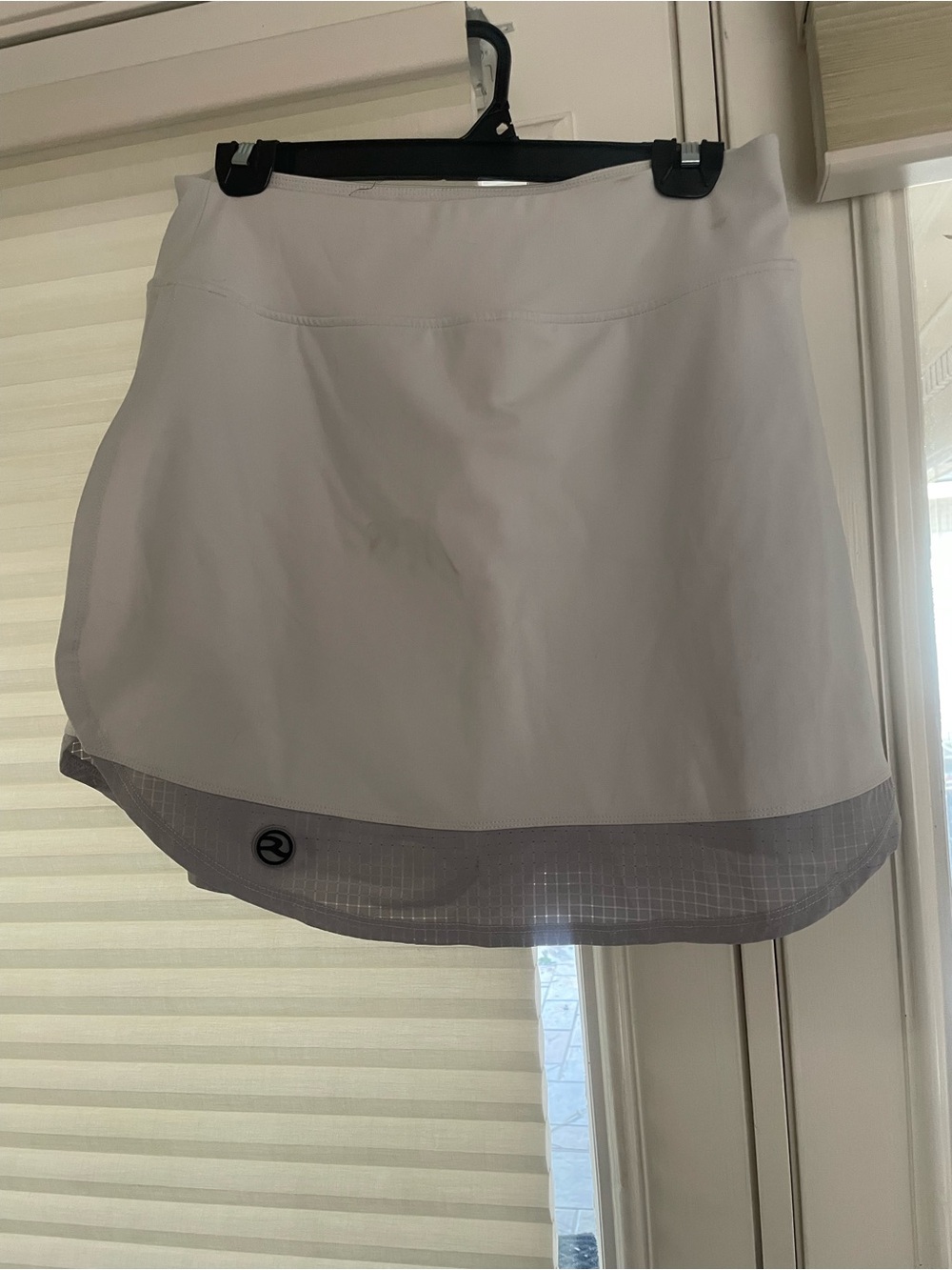 Large light gray skort with print shorts. 5 inch inseam.